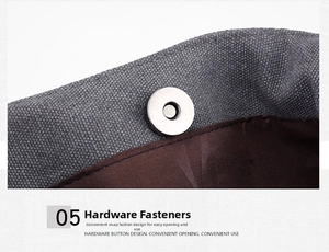Close-up of polished silver magnetic snap button on grey canvas tote bag detail