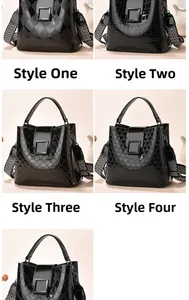 Detail of four black bucket bags with crocodile, rhombus, and geometric embossed textures