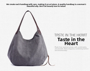Detail of grey washed canvas hobo bag with deep brown leather handle and spacious design