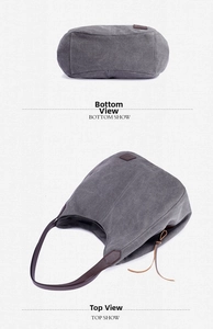Detail view of the gray canvas tote bag base and leather strap connectors on fabric