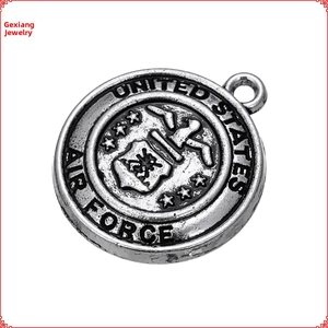 Close-up of antique silver United States Air Force round pendant with eagle emblem