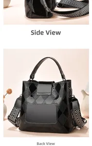 Detail view of black bucket bag showing geometric quilted texture and striped strap