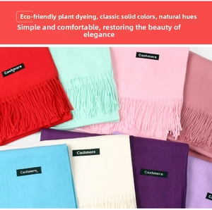 Selection of colorful cashmere style scarves featuring tassel edges and woven labels