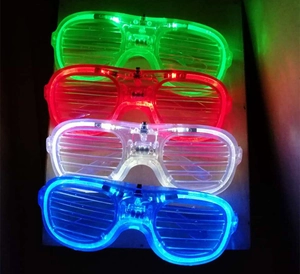 Vertical display of LED shutter glasses glowing in green, red, white, and blue colors