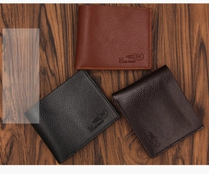 Short bifold men's wallets in brown and black litchi pattern leather on wooden surface