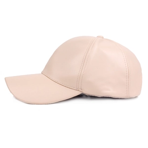 Close-up of premium beige faux leather baseball cap showing fine texture and neat stitching