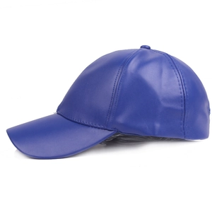 Detailed side view of a royal blue PU leather baseball cap with waterproof texture