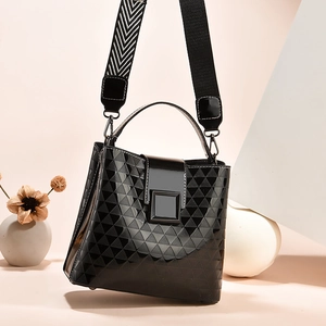 Fashionable black faux leather bucket bag with embossed triangle pattern and wide strap