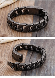 Detail of vintage silver Cuban link bracelet with rectangular slide clasp on wooden surface