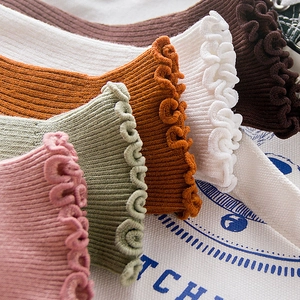 Breathable cotton crew socks with frill trim in pink, green, white, and brown colors