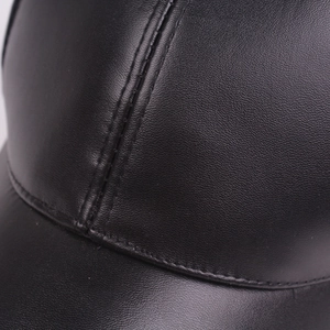 Classic black leather baseball cap with detailed lychee grain texture and fine stitching