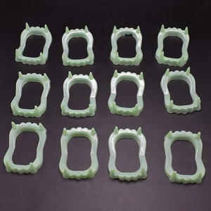 Set of 12 glowing vampire fangs props for Halloween parties and prank costumes
