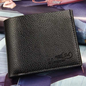 Men's bifold short wallet in black lychee grain PU leather on a stylish magazine background