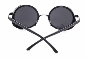 Detail view of steampunk round sunglasses with black metal frame and mesh side shields