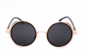 Detail of round punk steampunk sunglasses with a gold metal frame and dark grey lenses