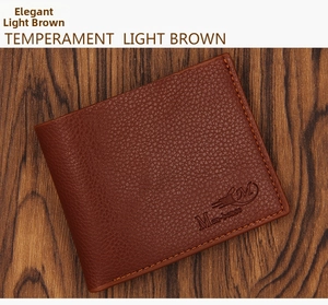 Detail of dark brown men's wallet with lychee grain texture and orange contrast stitching
