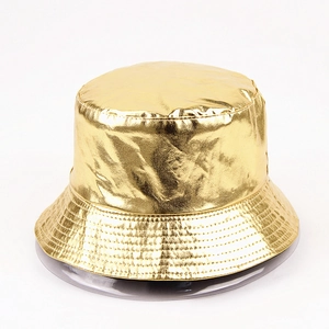 Detail of metallic gold bucket hat featuring shiny coated fabric and stitched brim rows
