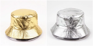 Detailed view of metallic gold and silver bucket hats with reinforced brim stitching