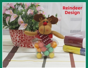 Star-shaped clear candy jar with a plush reindeer topper and red festive scarf detail