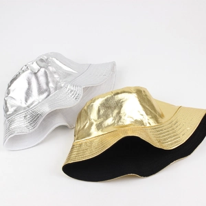 Metallic gold and silver reversible bucket hats with shiny PU coating and stitching