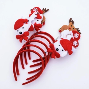 Close-up of four Christmas headbands featuring Santa, reindeer, and snowman figures
