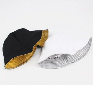 Detail of reversible bucket hat showing metallic silver and gold interior texture