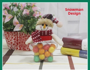 Star-shaped Christmas snowman candy jar with colorful sweets and plush hat detail