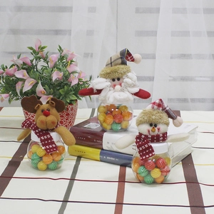Christmas candy jars with Santa, Reindeer, and Snowman plush lids and clear round bases