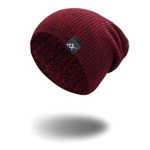 Striped knit beanie hat in red and black color blend for winter outdoor fashion