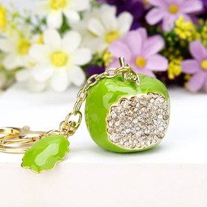 Sparkling green apple keychain with crystals and gold leaf charm on metal ring