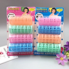 Detail view of colorful baby hair clip set in blister card packaging with floral decor