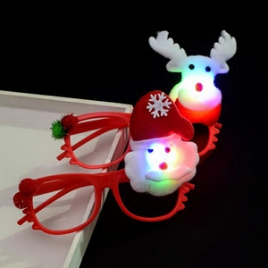Close-up of glowing Christmas glasses featuring LED Santa Claus and Reindeer designs