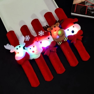 Close-up of five glowing LED Christmas slap bracelets with reindeer and snowman plush