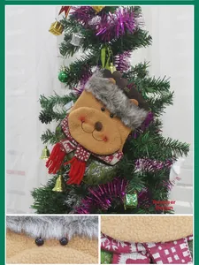 Detail of 3D reindeer Christmas stocking featuring plush fabric and knit scarf ornaments
