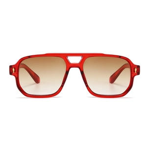 Detail of red transparent pilot sunglasses with double bridge and gold arrow hinge