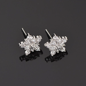 Close-up of snowflake earrings with AAA cubic zirconia in silver tone setting