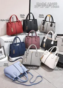 Collection of nine colorful lychee grain tote bags with metal charms in various shades