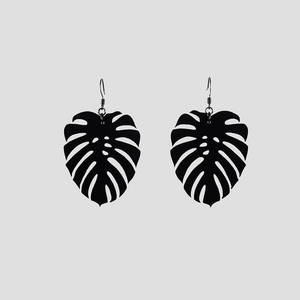 Minimalist black monstera leaf dangle earrings with cutout design in Nordic chic style
