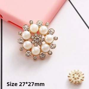 Macro detail of 27mm sunflower jewelry charm with pearls and crystal rhinestones