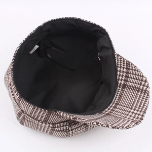 Houndstooth newsboy cap featuring black inner lining and adjustable drawstring for custom fit