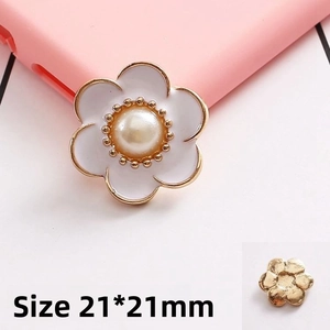 Macro detail of 21x21mm pearl flower charm with gold metal frame for DIY phone case decor