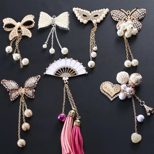 Detailed set of DIY phone case charms with bow, fan, and butterfly pearl designs