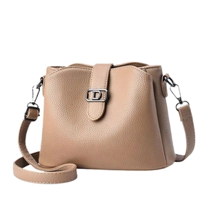Elegant light brown crossbody handbag with lychee texture and metallic D buckle