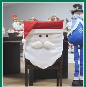 Detail of Santa Claus chair cover on a dining seat for Christmas party decorations