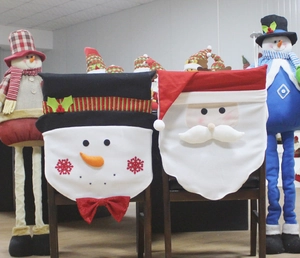 Detail of Christmas chair covers featuring 3D Santa Claus and Snowman decorative designs