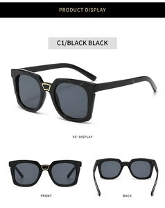 Three views of black square sunglasses with unique gold trapezoid bridge decoration