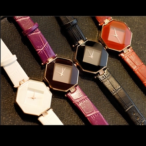 Close-up of four women's quartz watches with octagonal geometric cut glass and leather bands