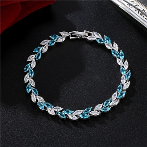 Detail view of silver marquise cut blue and white zircon bracelet on black background