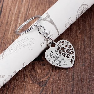 Silver heart keychain with Mother and Daughter Forever engraving on rustic wood