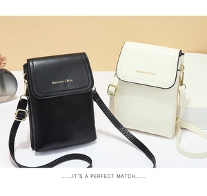Detail view of mini crossbody bags in black and beige PU leather with gold lettering